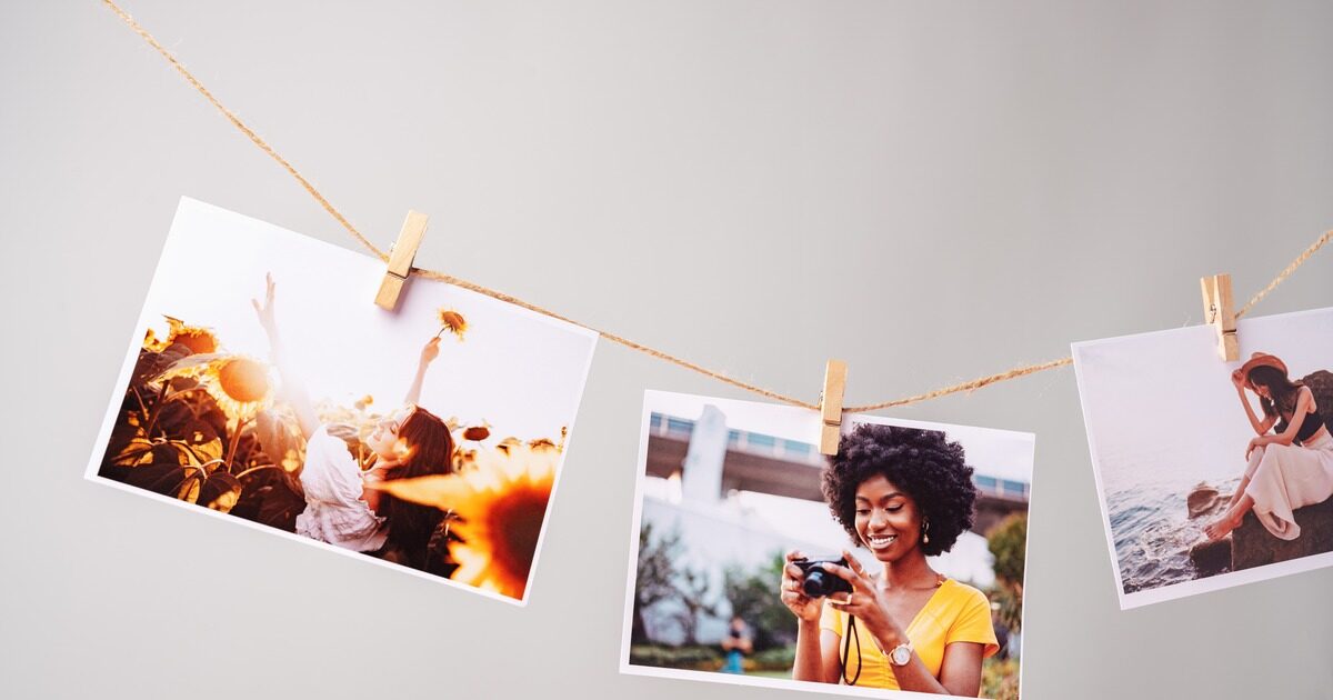Three printed lifestyle photographs pegged to a length of twine with wooden clips against a grey wall